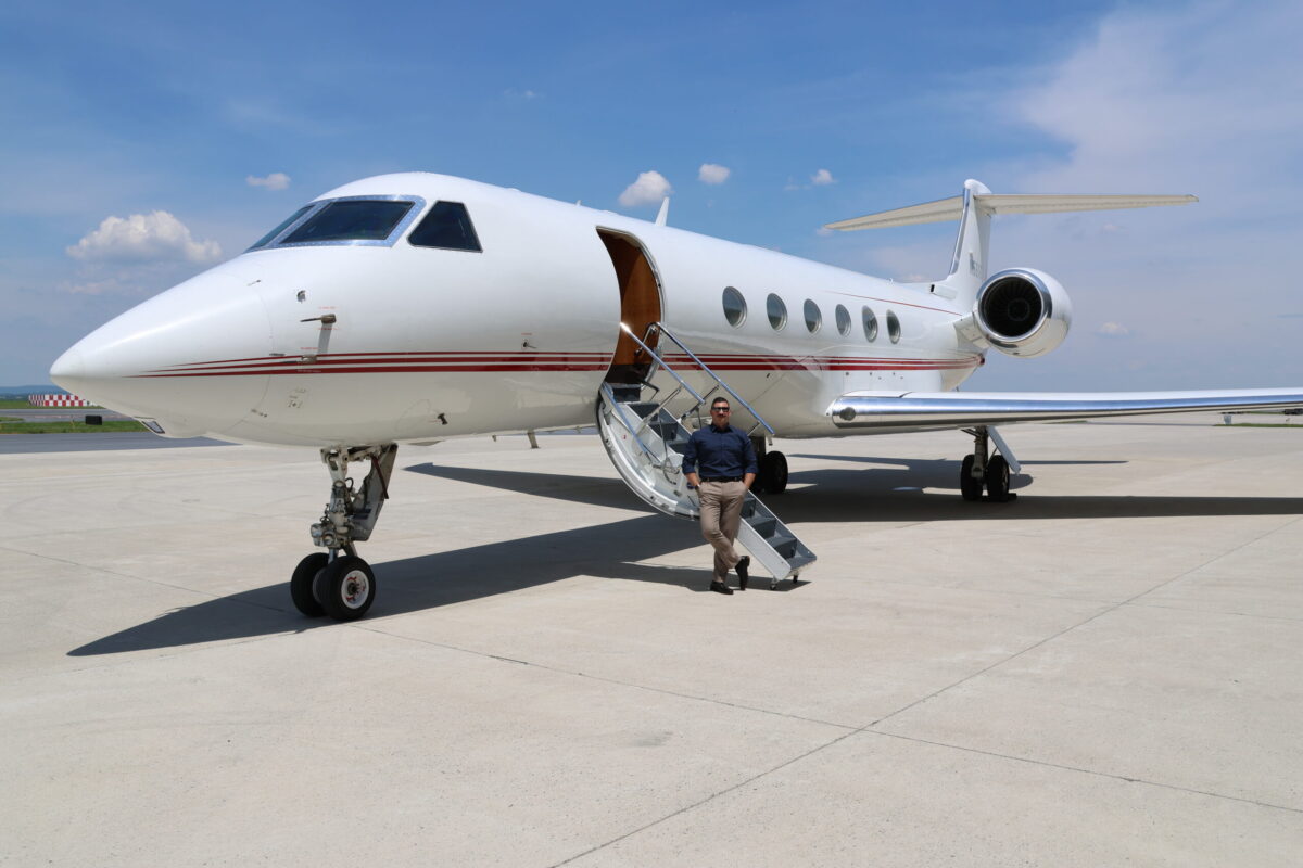 CEO Michael Vanacore-Netz in front of private jet