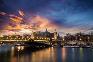 night time view of bridge in paris