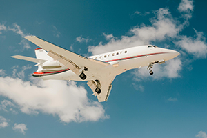 private jet flying in sky